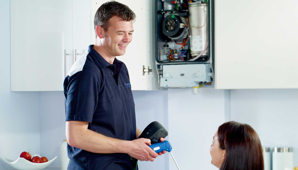 F.G. Welch engineer servicing a boiler